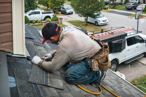 Professional Roof Replacement technician working in Strafford, NH